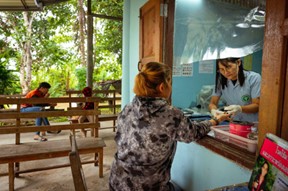 Darunee collects blood from a malaria patient at a malaria clinic in Mae Sariang. © WHO 2023