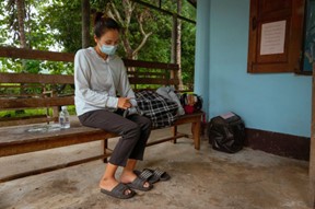 A Karen mother seeks help at a local health clinic for her child, who has a high fever due to malaria. © WHO 2023
