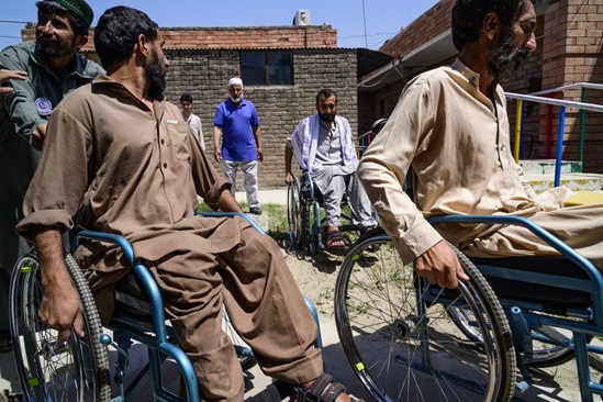 Persons with disabilities getting classes on how to use properly their wheelchairs in different grounds in the backyard of the Paraplegic Centre of Peshawar, Pakistan.