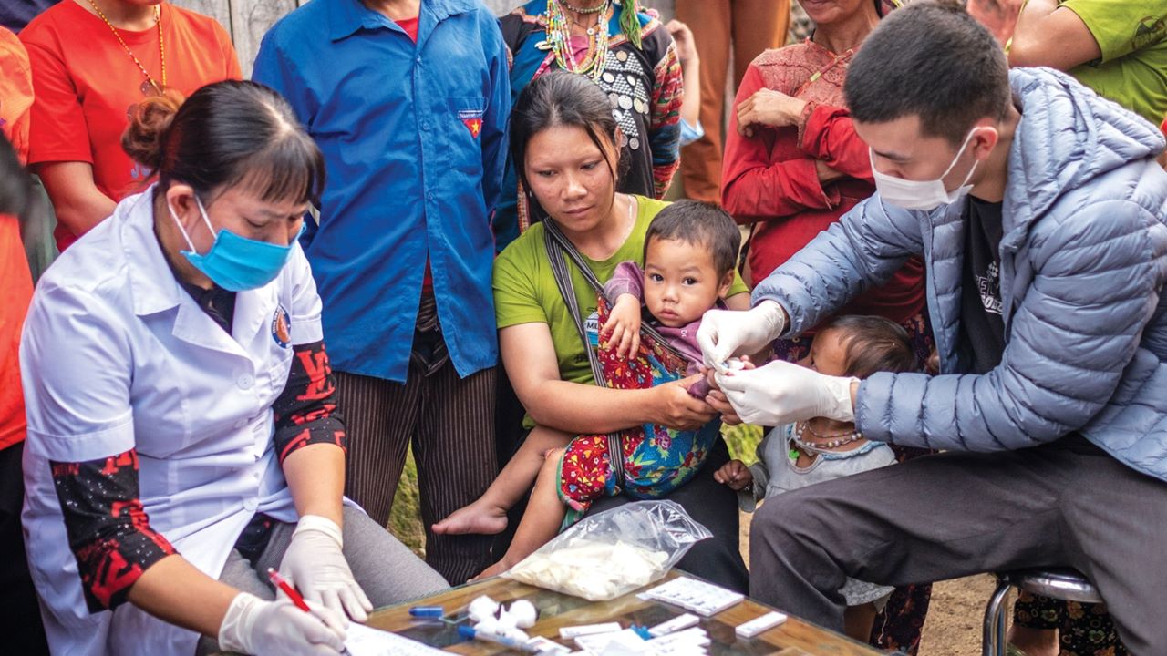 Heath providers vaccinating children in a community