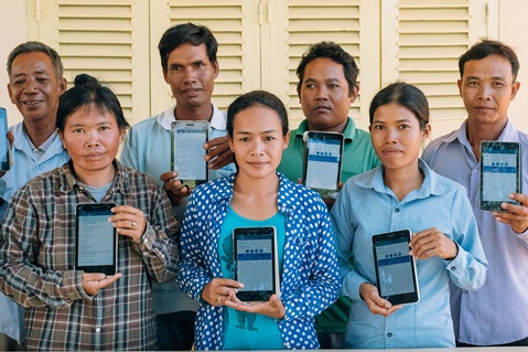 Group of people holding digital tablets
