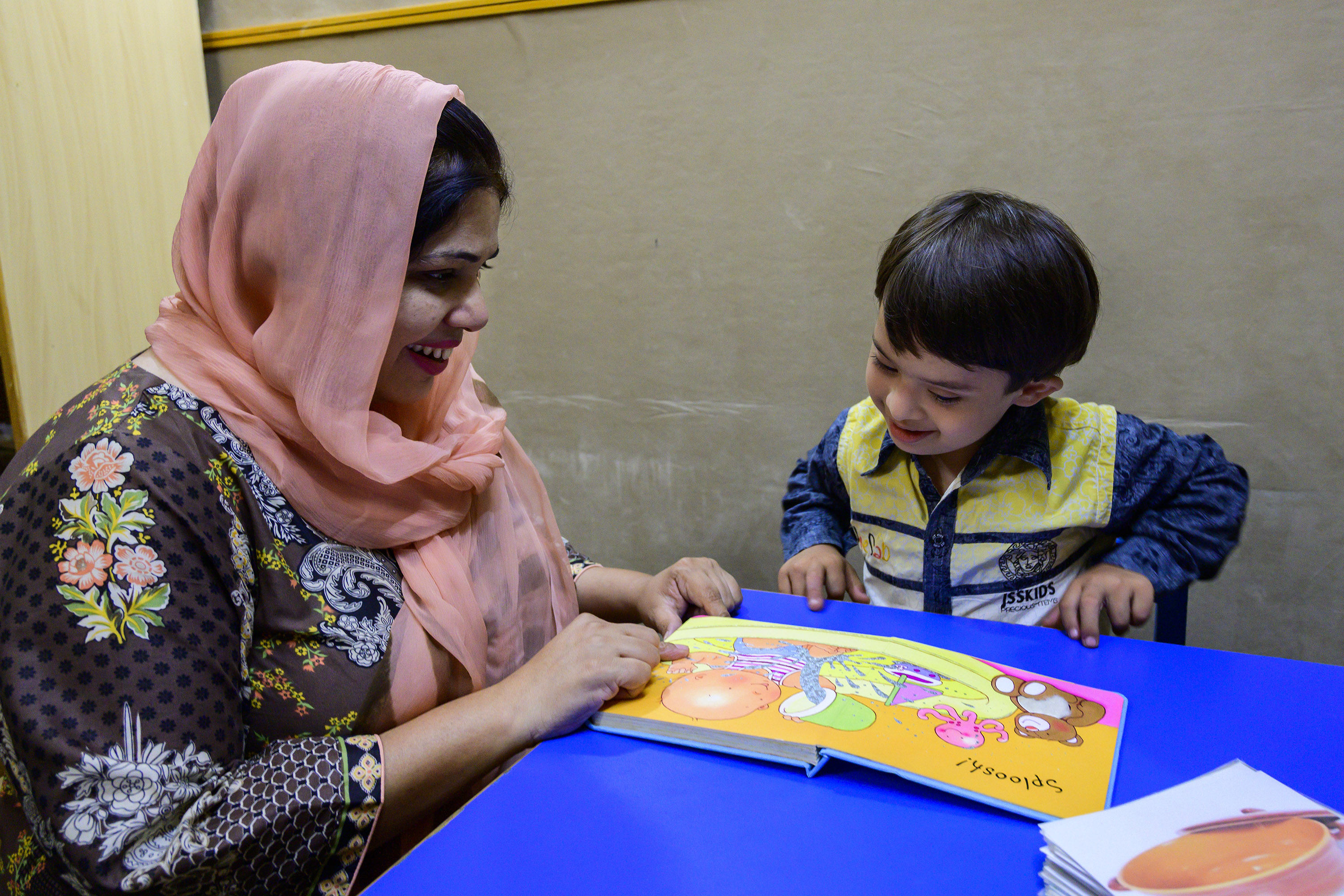 Woman and child reading a book