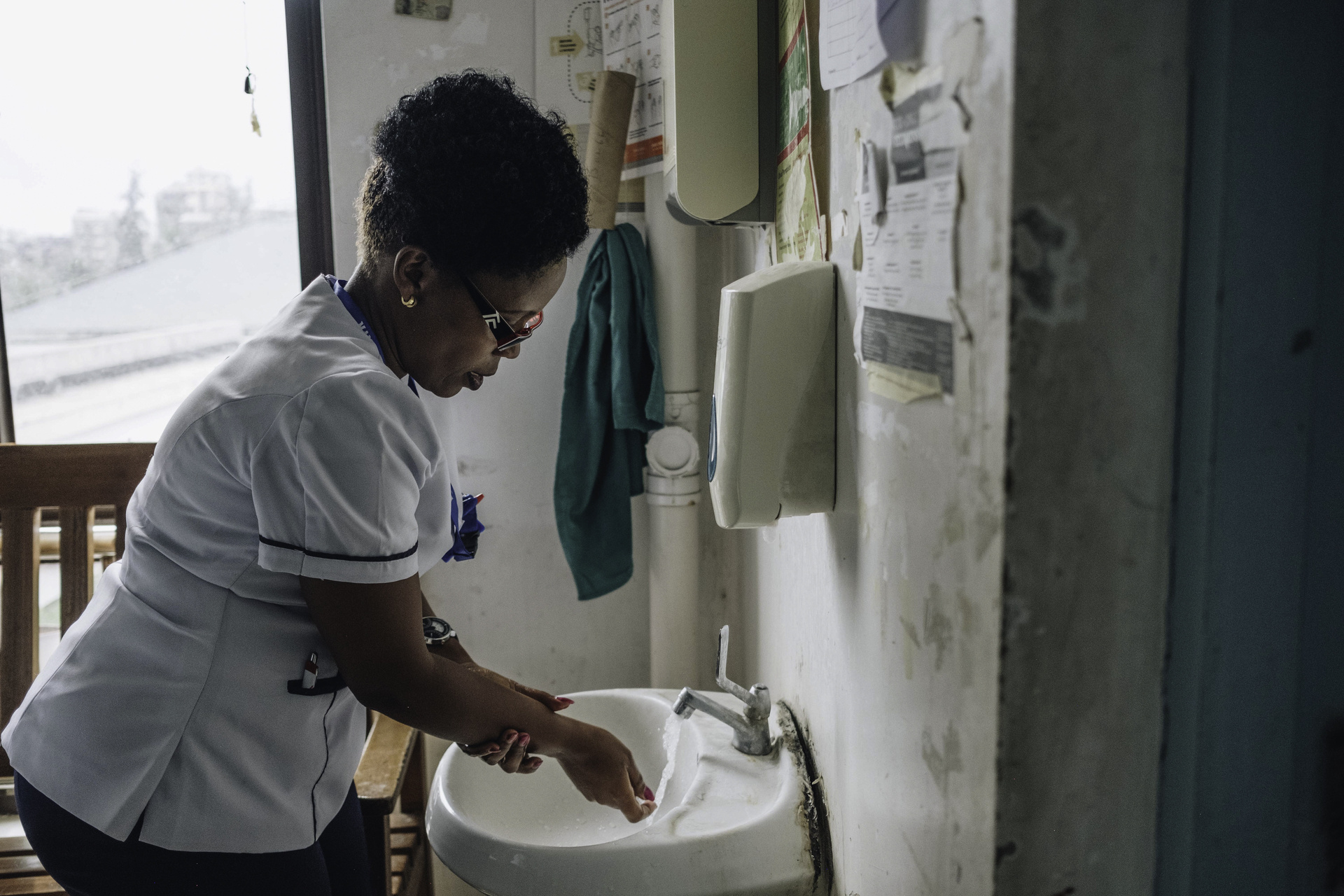 Health worker washing her hands