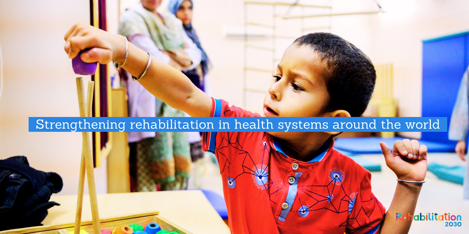a young child in foreground text reads Strengthening rehabilitation in health systems around the world