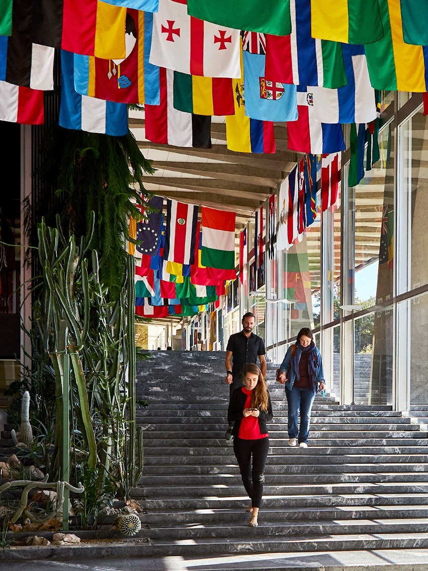 WHO HQ main hall 3_4 People walking down stairs at WHO headquarters main hall.