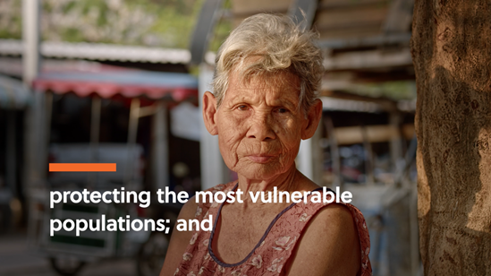 An older adult woman looks at the camera. Text says protecting the most vulnerable populations.