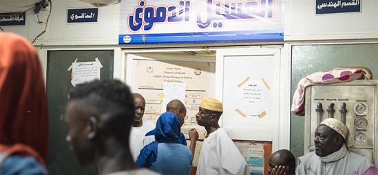 A screenshot of people in a dialysis centre.