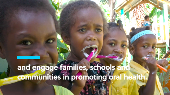 Children brushing their teeth. Text says and engage families, schools and communities in promoting oral health.