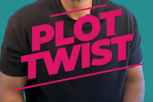 The chest part of a man with the overlay text "Plot twist" in bright pink.