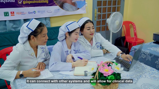 Three nurses look at a laptop screen, learning about DHIS2 system.
