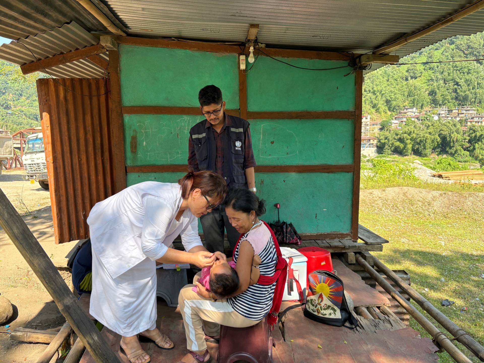 Strengthening Immunization in Arunachal Pradesh A health worker vaccinates a child in Pachan Morang Colony, East Kameng, with WHO India support to boost immunization and prevent disease outbreaks.
