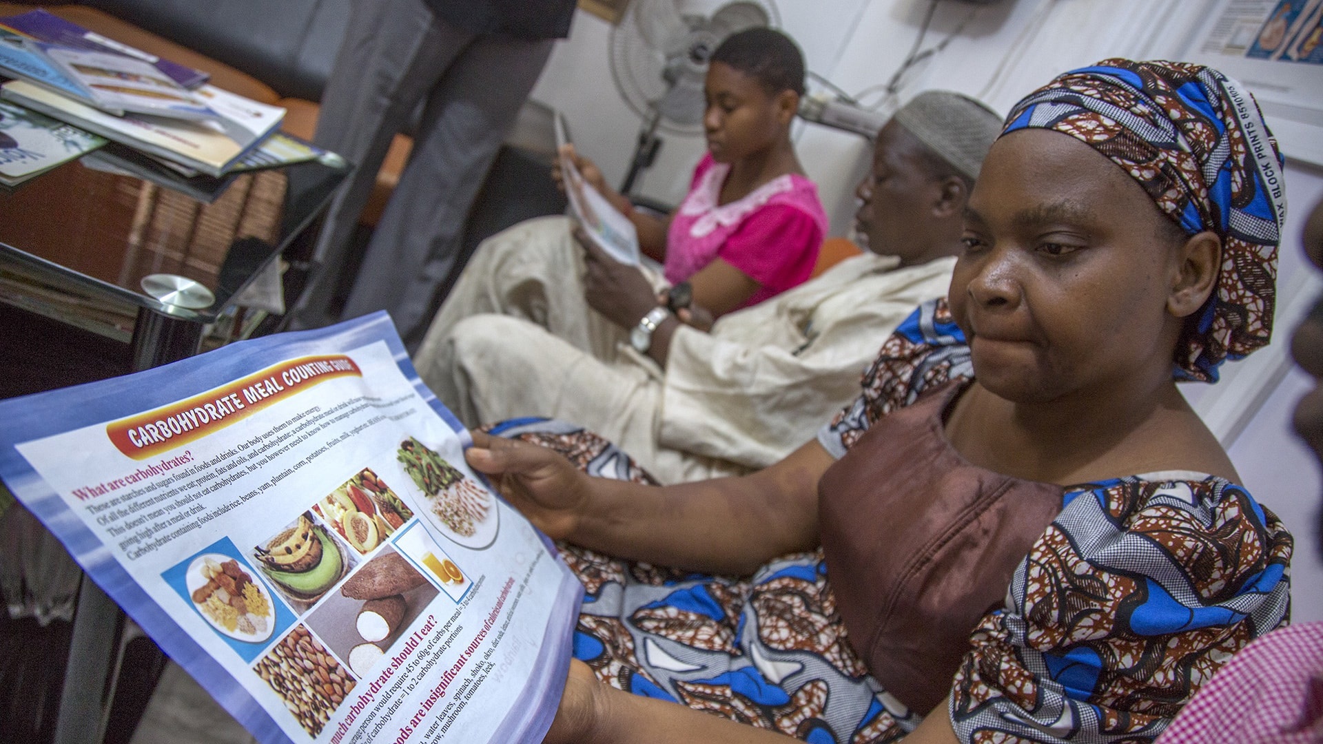 2 Photo of diabetic patients reading about nutritional information at a medical centre in Lagos.