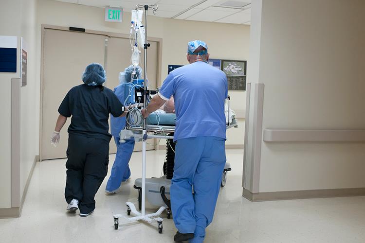 Patient with doctors in the hospital