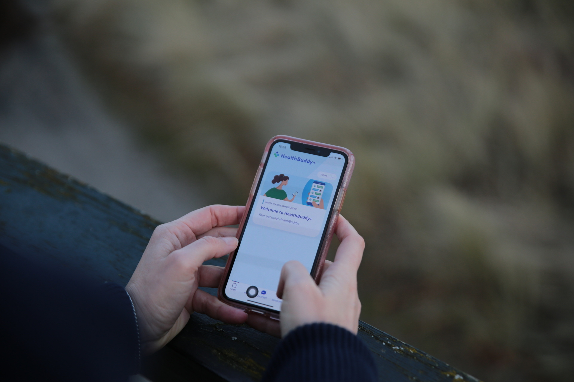 Two hands holding a mobile phone