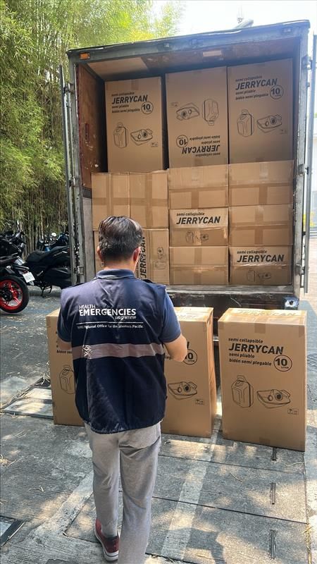 WHO staff load emergency supplies to be delivered to areas across Chuuk State that were affected by Typhoon Sinlaku