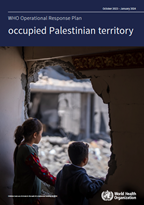 Children look out of a hole in the wall of a residential building.