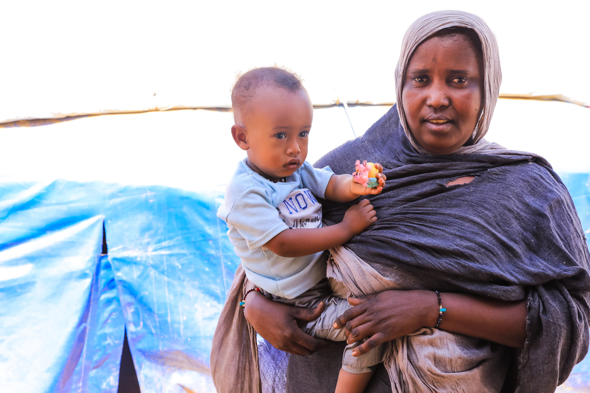 Mother holds child