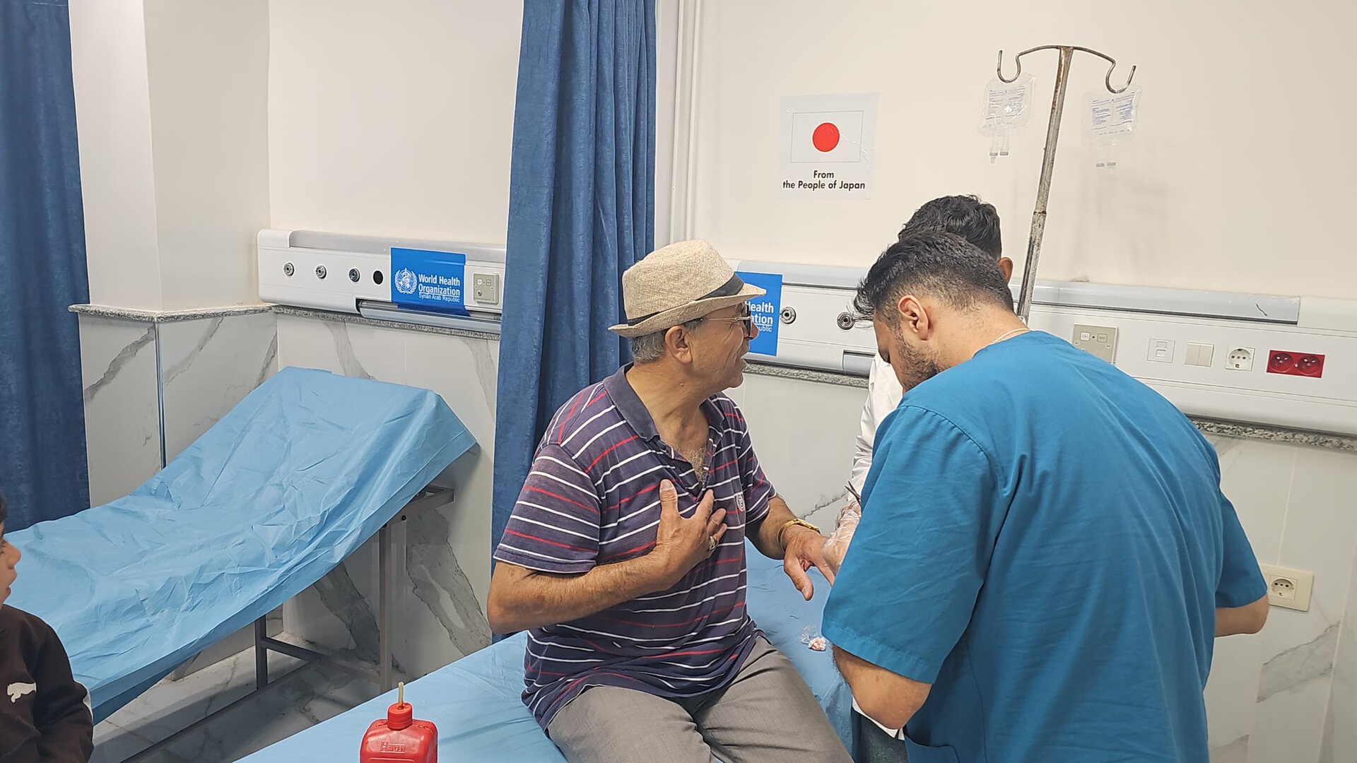 Japan - 4 A beneficiary of the project receives health services at Al-Qamishli National Hospital.