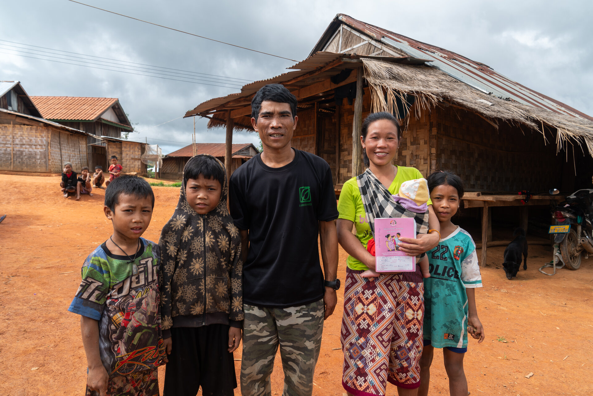 Laotian family posing in front of camera