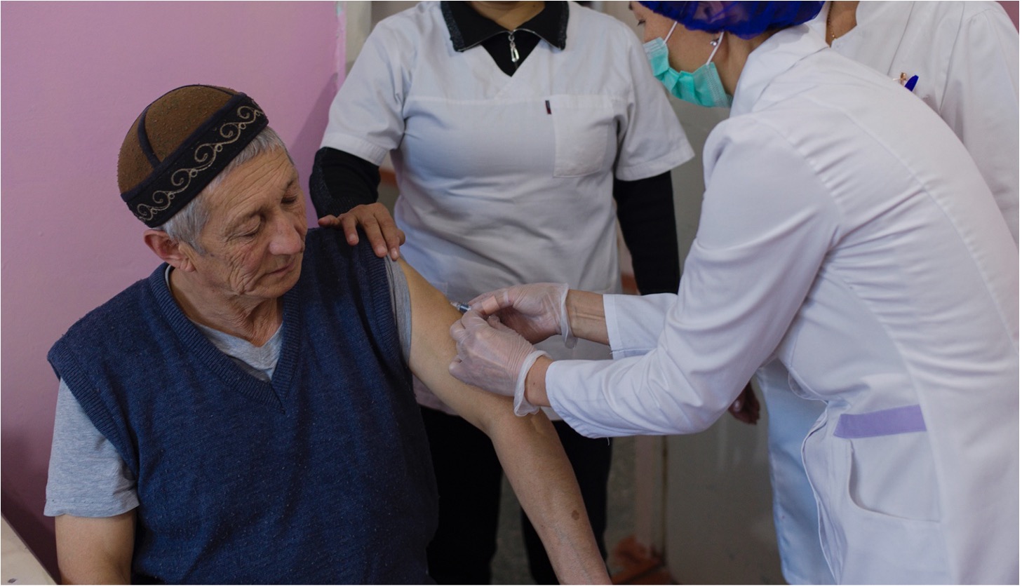 A 62-year-old man receives a dose of flu vaccine at the Nijnaya Serafimovka Center for the Elderly and Disabled in Chuy Oblast, Kyrgyzstan, 25 November 2022