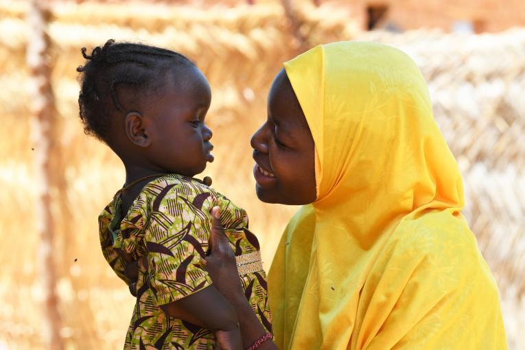Nurse Peace (right) counsels a patient before she gets screened for cervical cancer at the RAiSE Foundation office in Niger State on 24 February 2021.