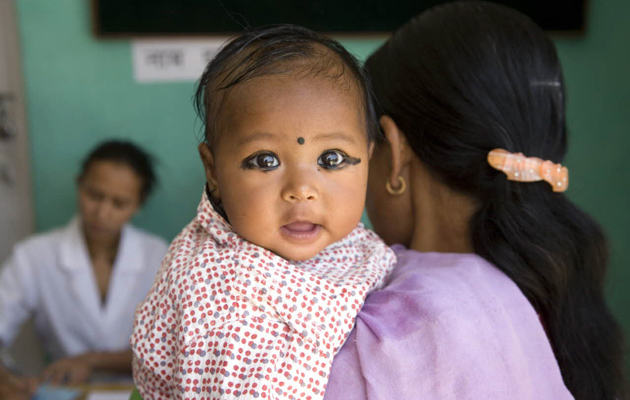 A mother and her child during a visit to a health clinic. Nepal figures among the 21 countries that could eliminate malaria by 2020.