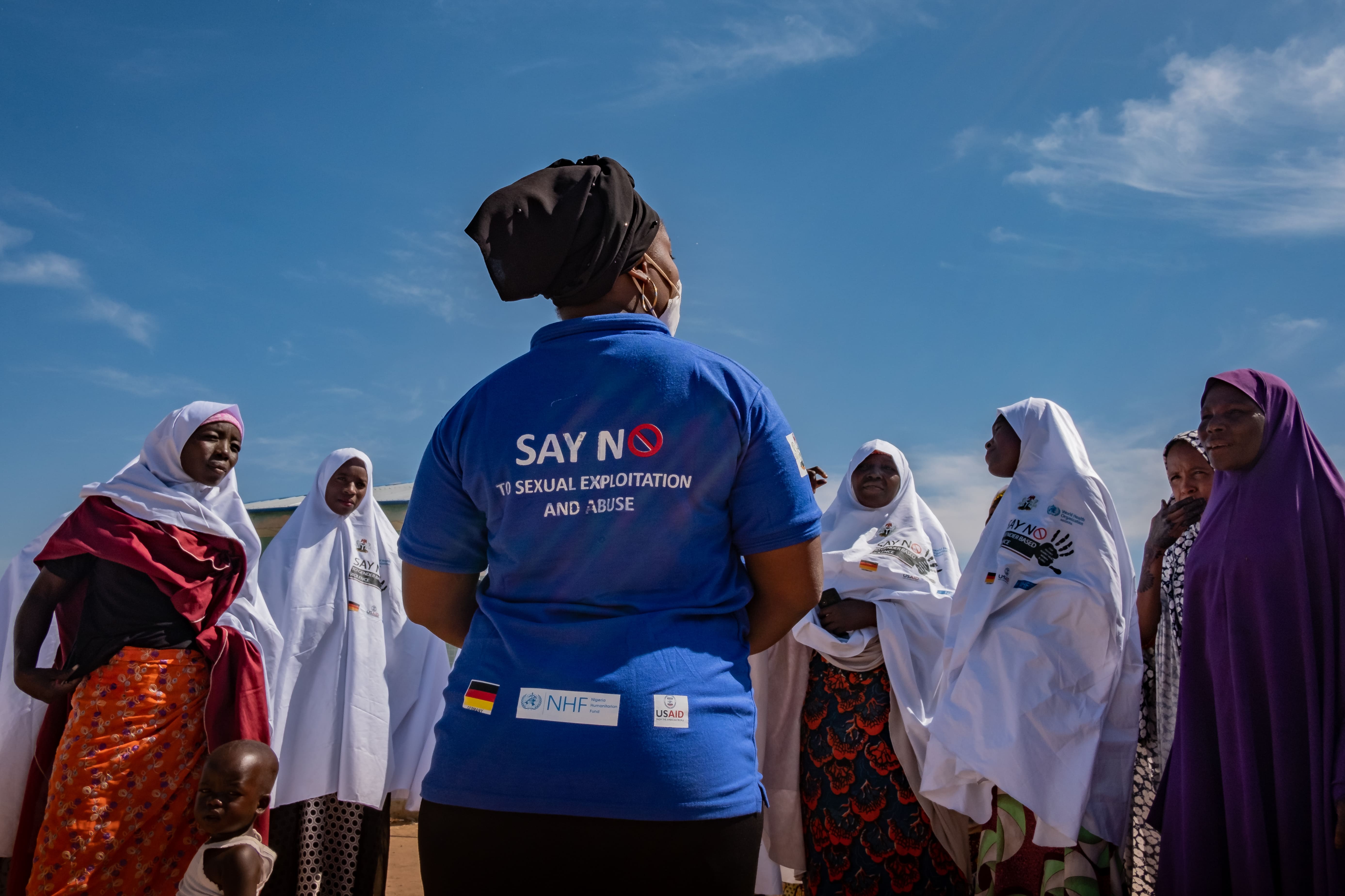 Health worker discusses gender-based violence with displaced women in Nigeria.