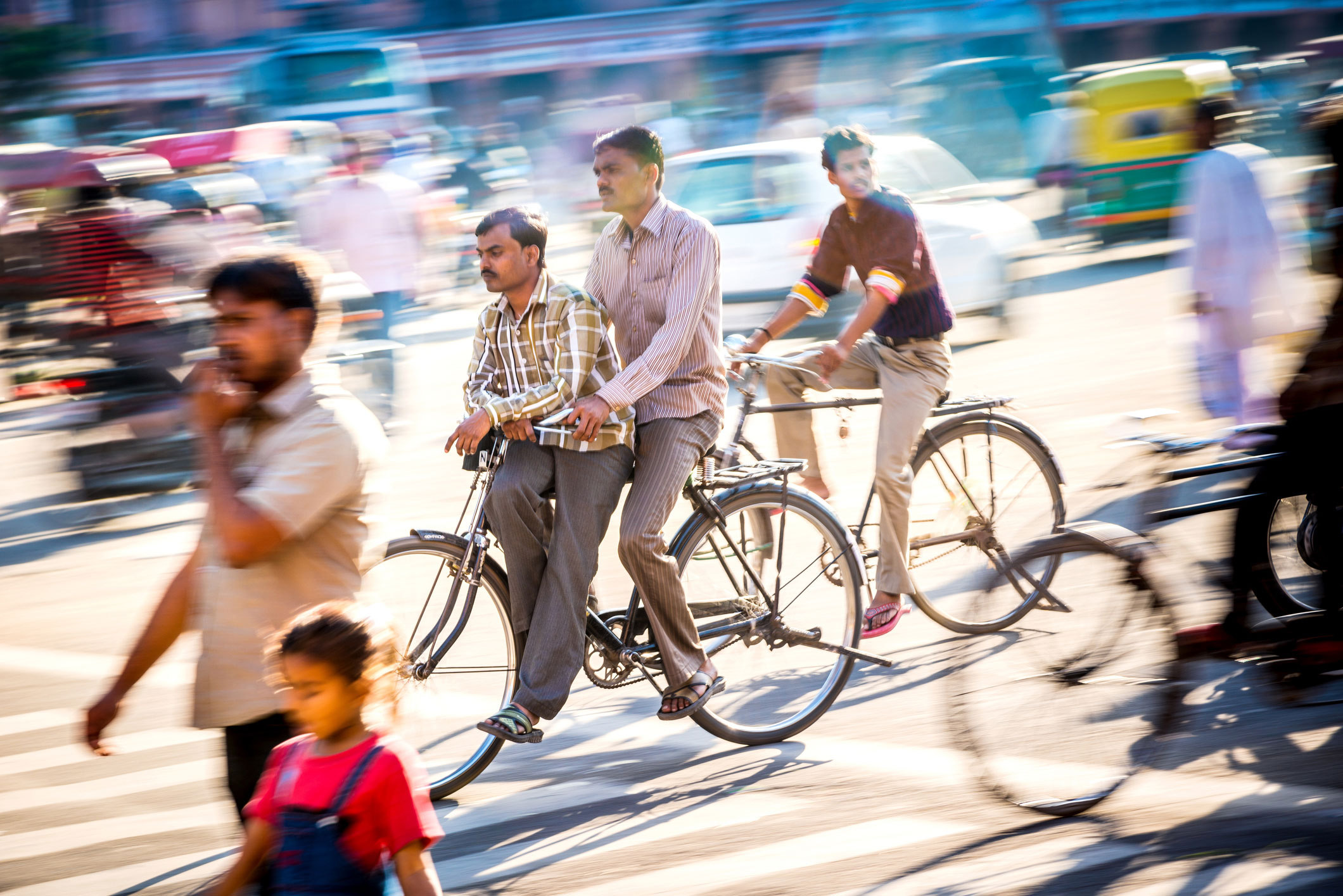 Cyclists and pedestrians in busy traffic