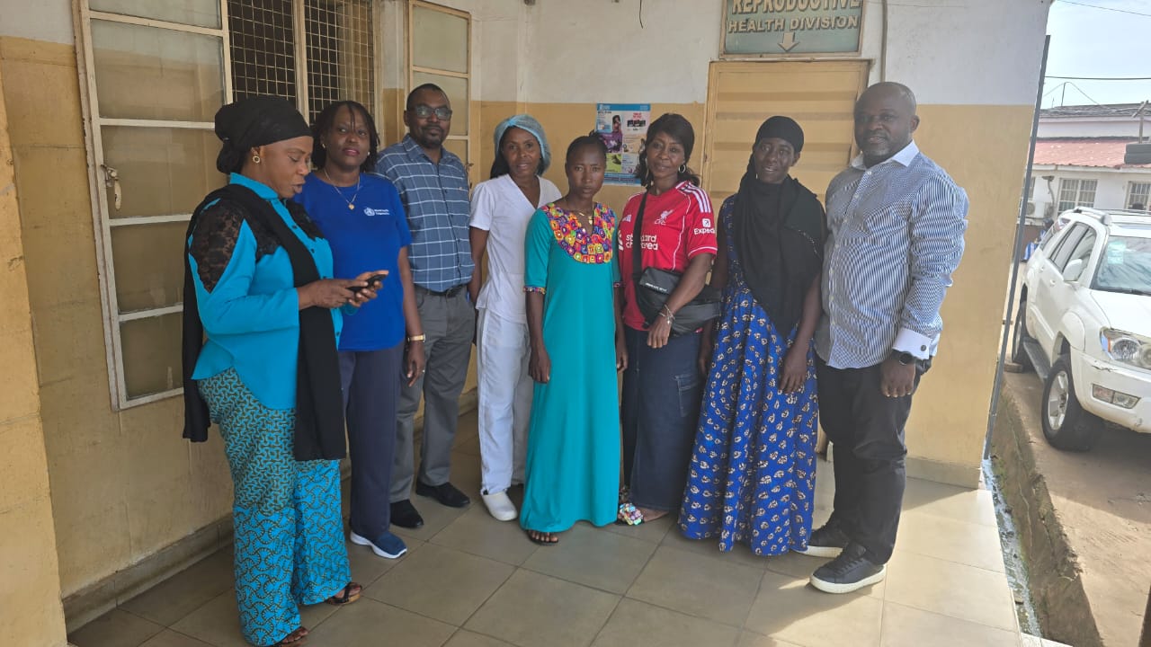 Cervical Cancer Team Sierra Leone Eight members of the cervical cancer team in Sierra Leone standing together outside a clinic