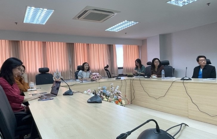 A group of people in a meeting room