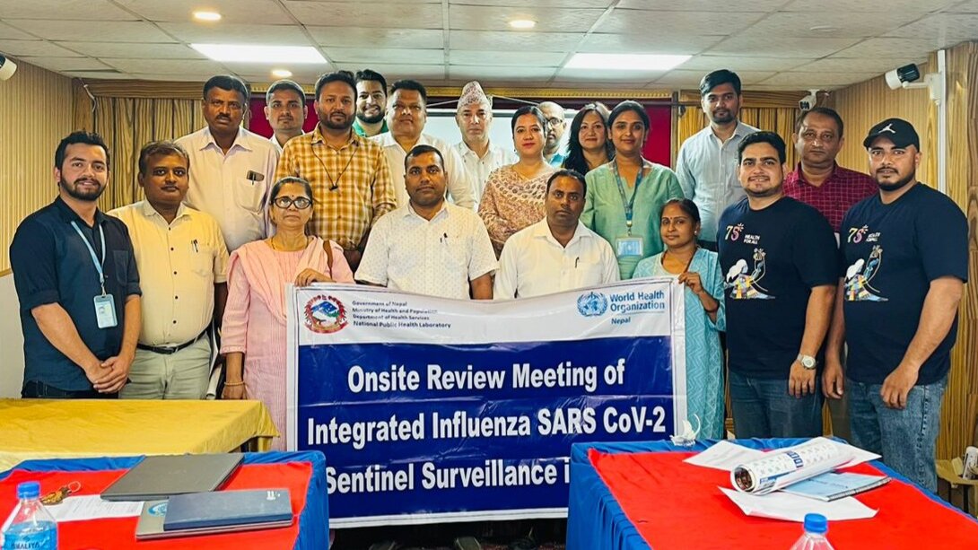 Group photo of participants of a meeting related to integrated surveillance of influenza and SARS CoV-2.