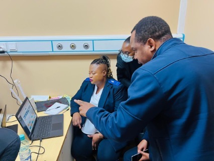 Maseru District Hospital staff receive one-on-one coaching from WHO facilitator on how to navigate the AFFLU system
