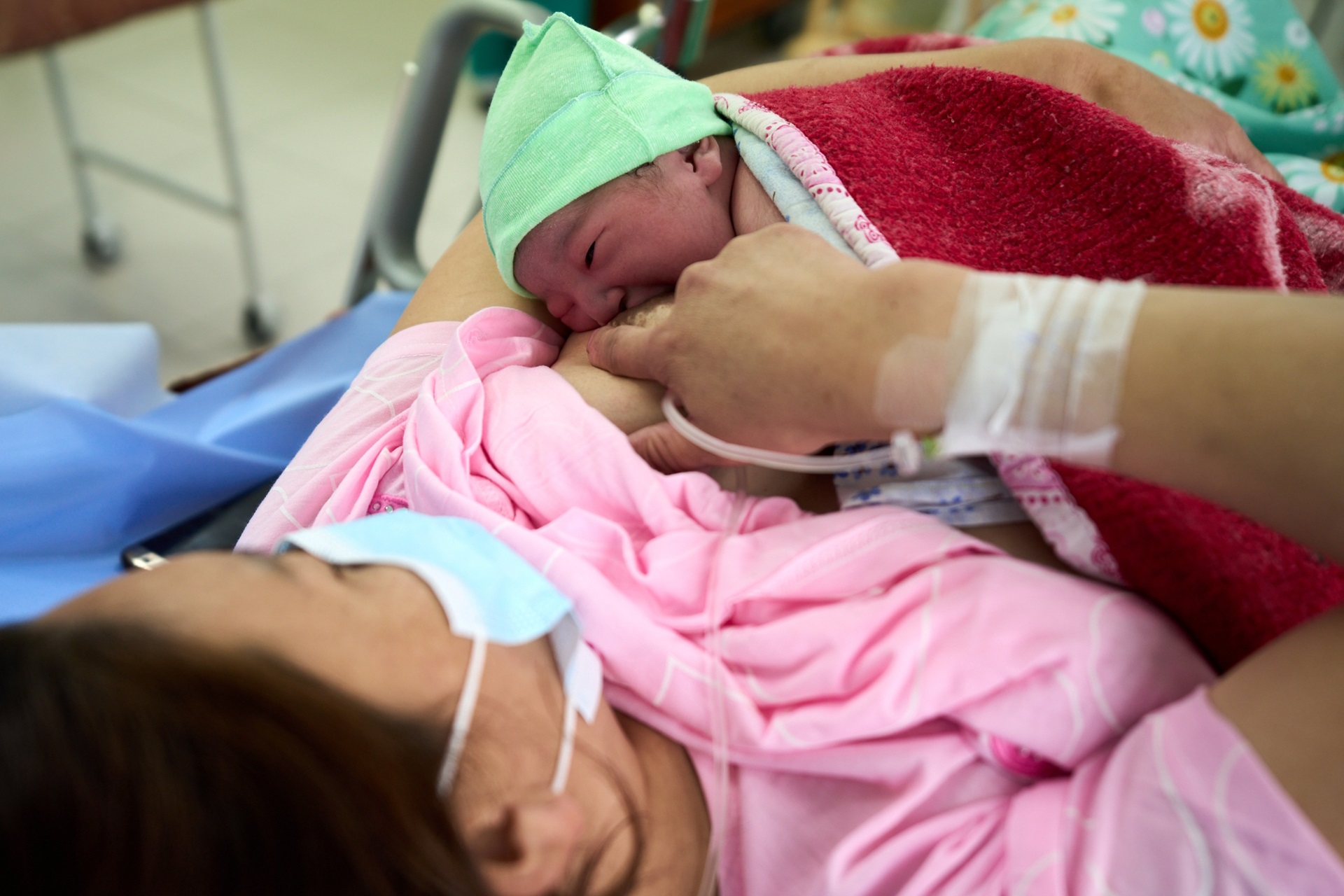 An image depicting a breastfeeding position during KMC