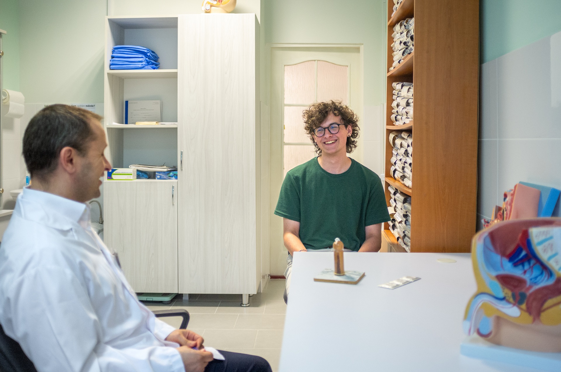 Urologist Dr Radu consults with a patient at the YK Neovita Centre in Chișinău, Moldova, on 23 June 2022.