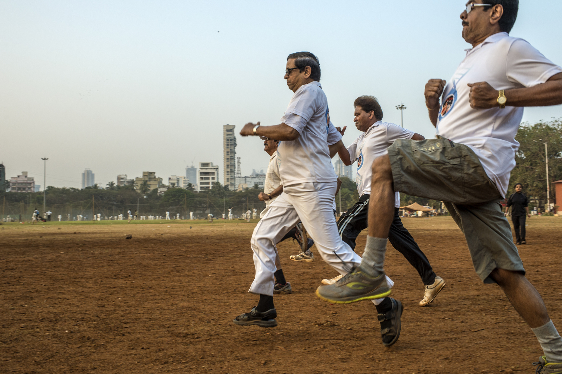 Group of men exercising early morning in a park