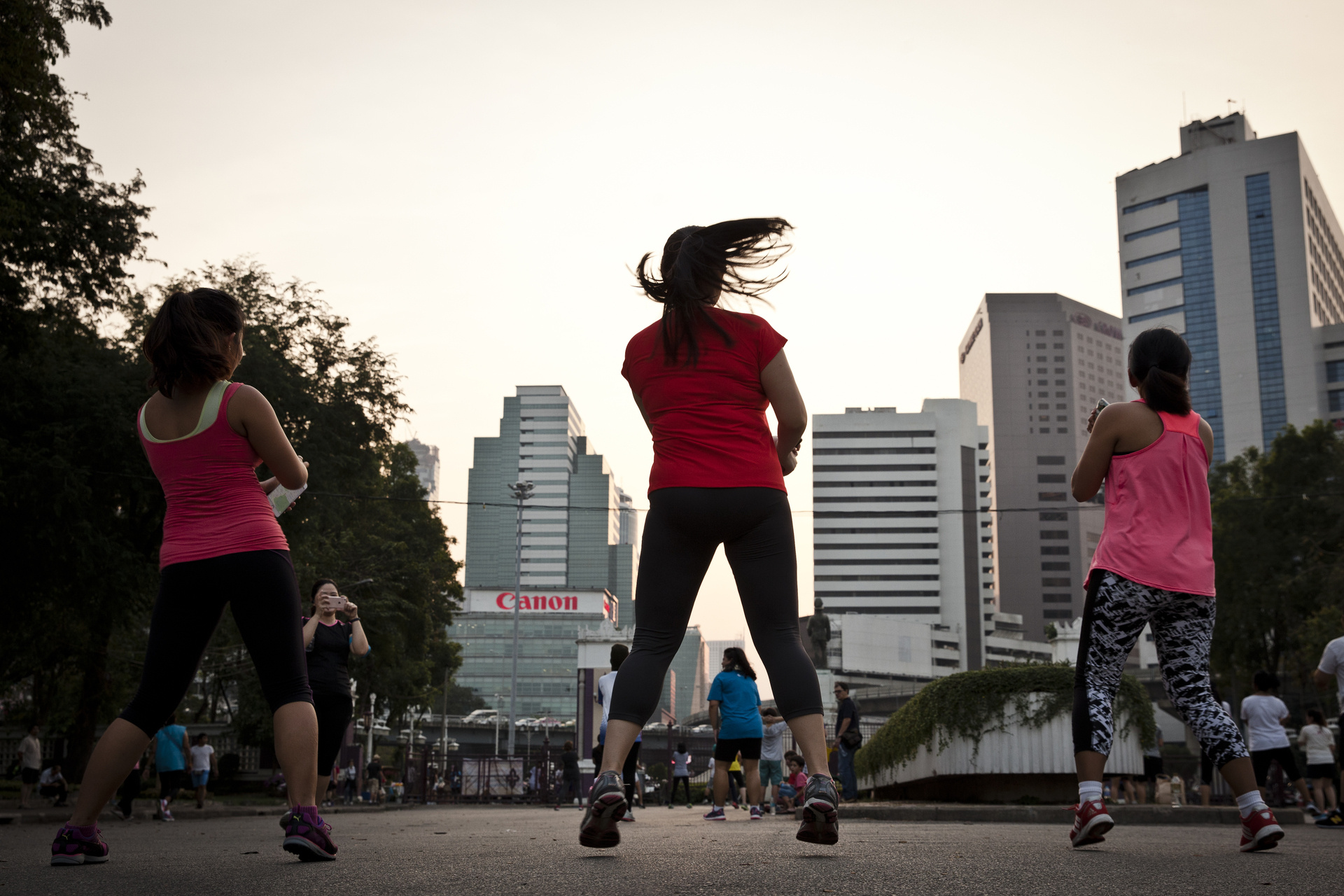People exercising at Lumpini park in central Bangkok.