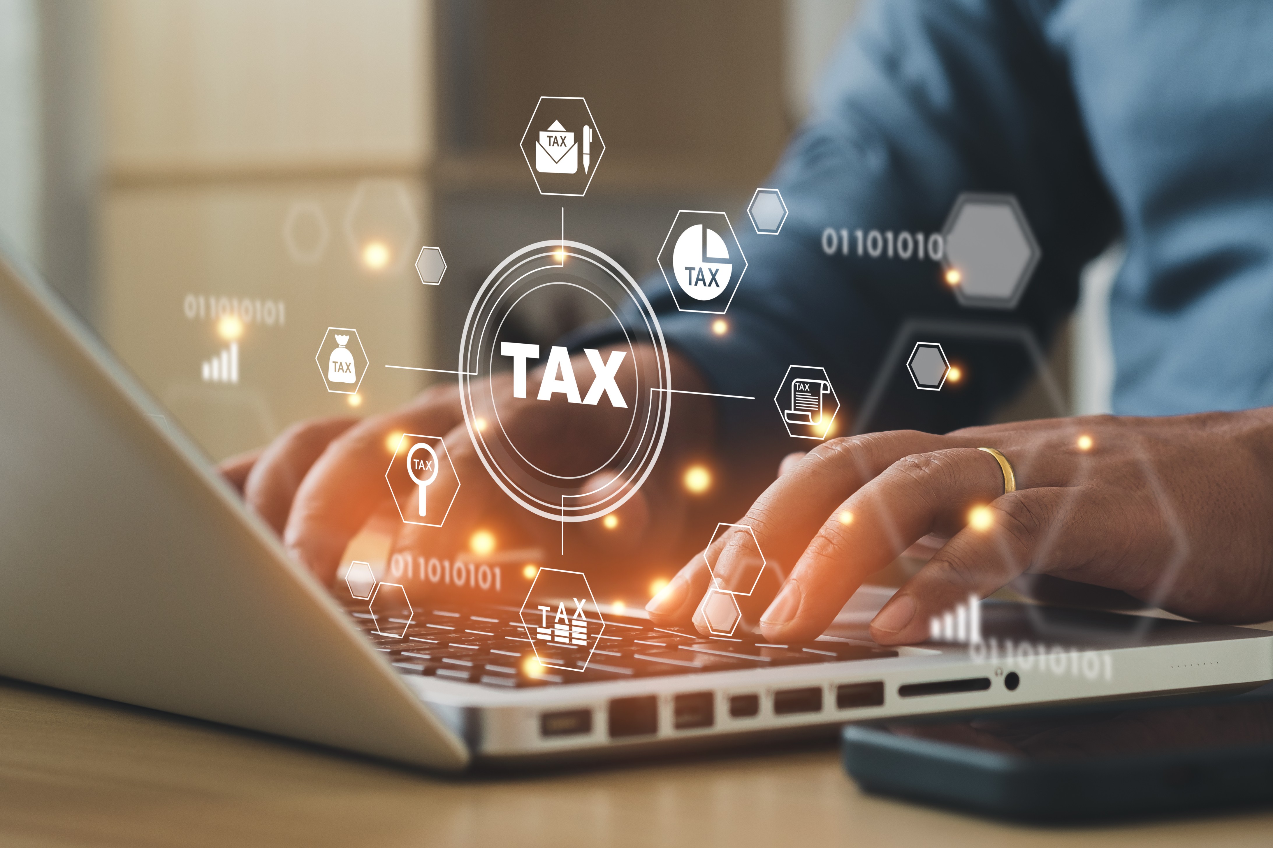 Business using a computer to complete Individual income tax return form online for tax payment.
