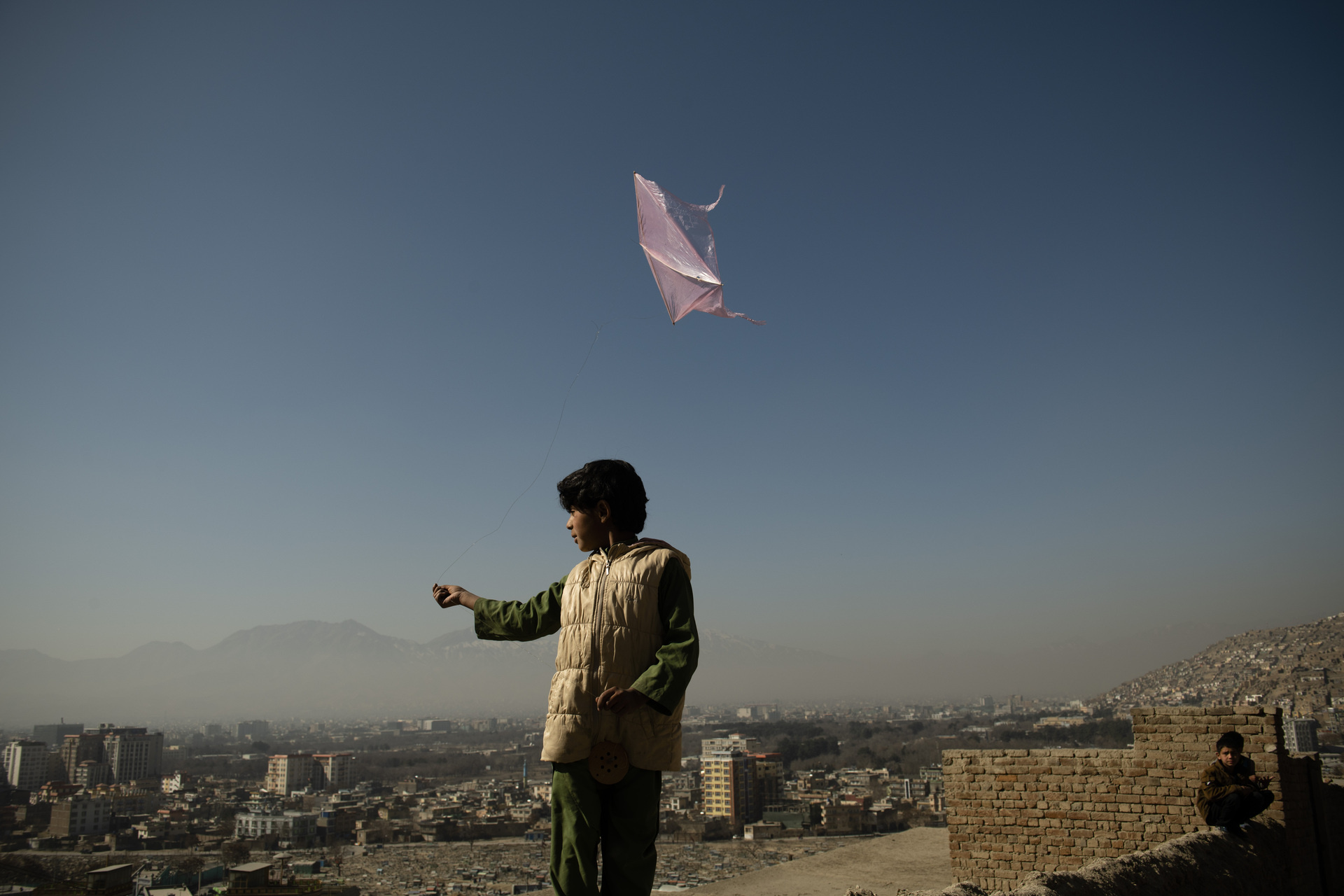 Young boy flying a kite