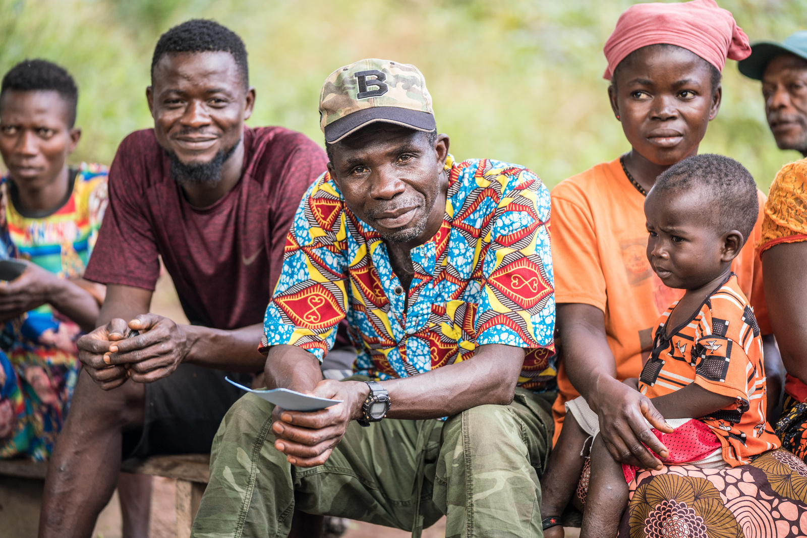 Chief Almamy (centre) the chief of the village of Makontakay, Sierra Leone, comes for his second dose of COVID-19 vaccine from a mobile health team on 8 December 2022.