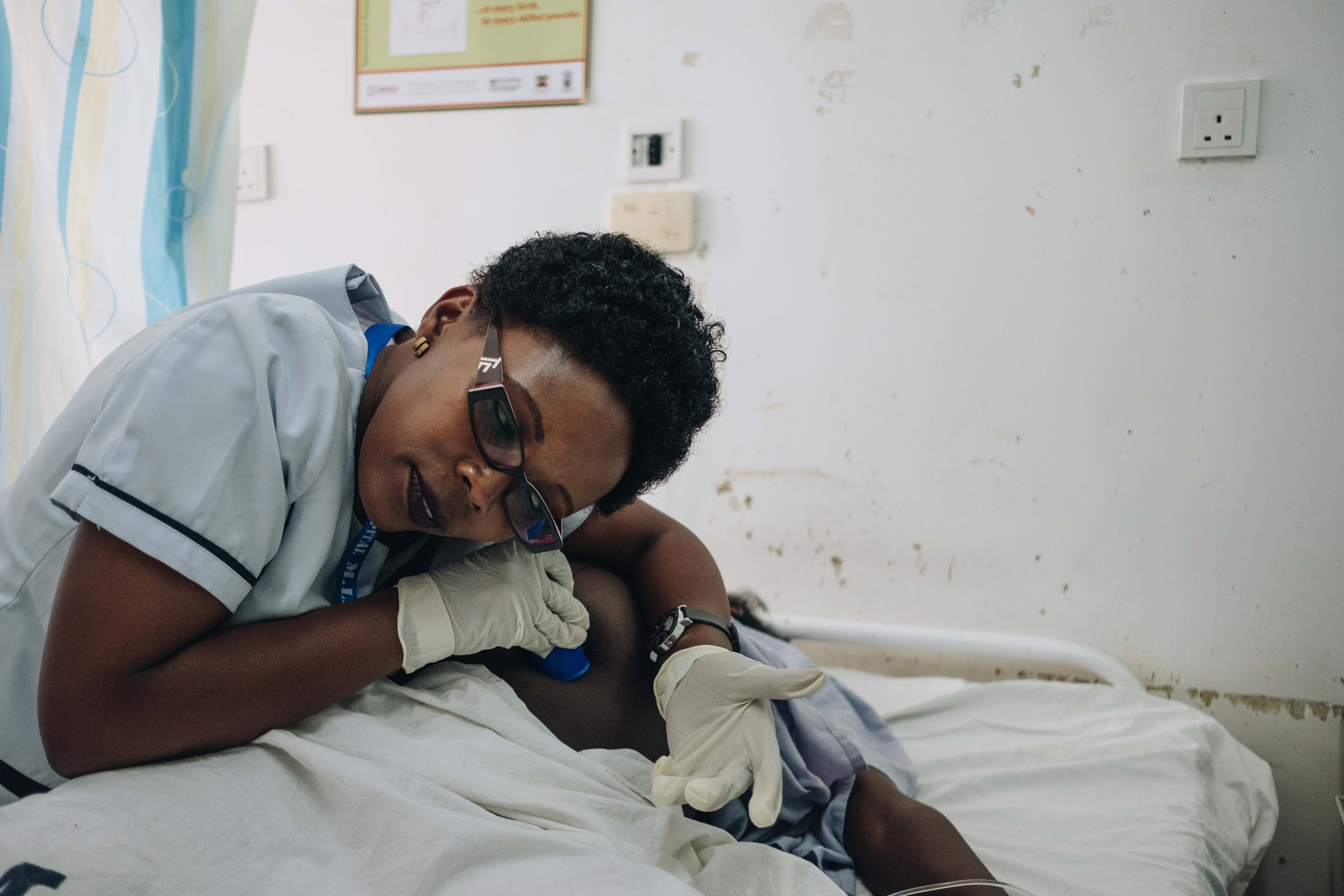 Nurse examining patient