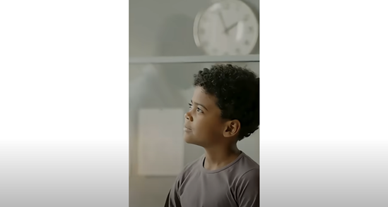 A boy looking up to the left
