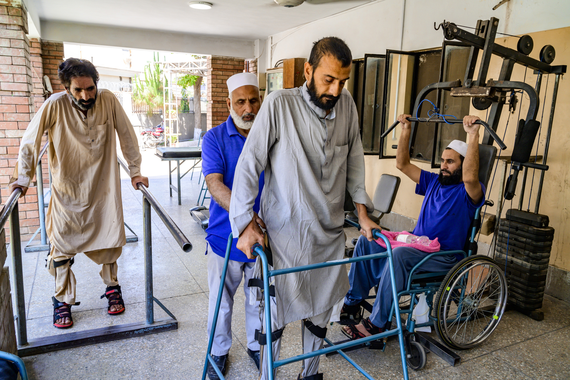 Patient having physical therapy rehabilitation by a health worker indoors