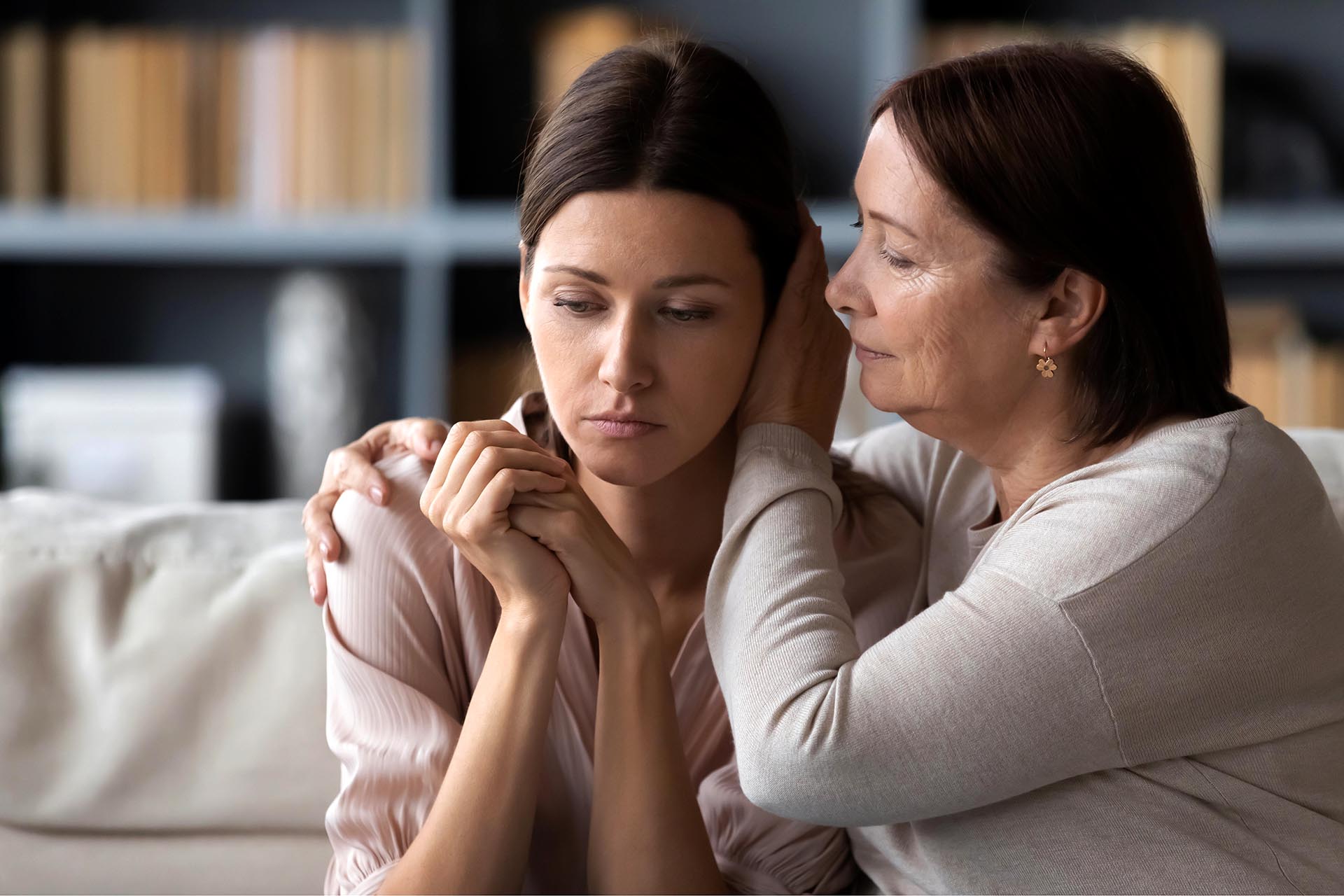 A women is comforting another woman