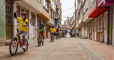 Children riding bicycles in the street