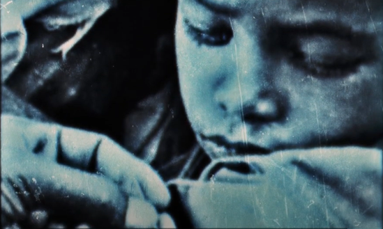 history of vaccines essay A black and white old photograph of a boy's face looking down at his arm.
