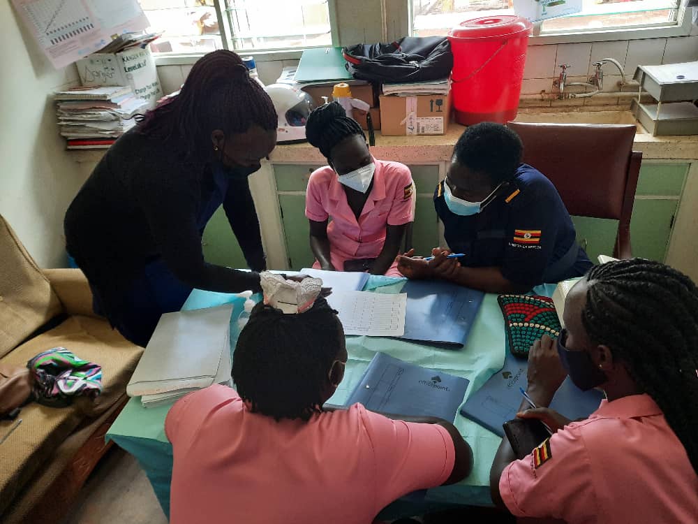 A training on hand hygiene compliance with health workers in Uganda.