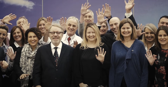 Group of people waving