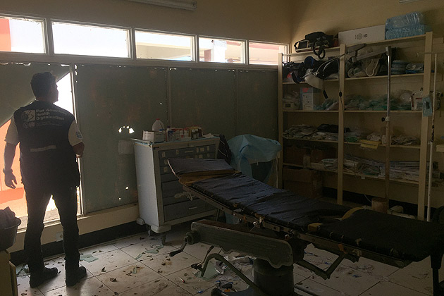 A man in a damaged hospital room in Antigua and Barbuda