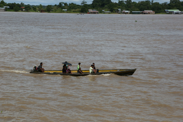 A river boat with people in it, in Brazil