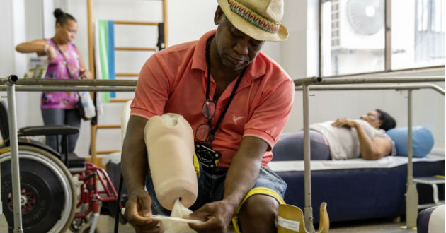 A man takes care of his amputated leg.